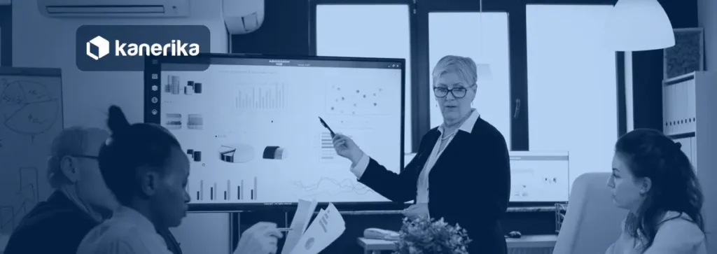 Ontology vs semantic layer banner showing a data team reviewing business metrics on a screen