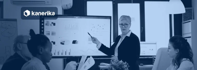 Ontology vs semantic layer banner showing a data team reviewing business metrics on a screen
