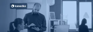 SaaS product development company team reviewing a product plan on a tablet with analytics dashboards, Kanerika banner