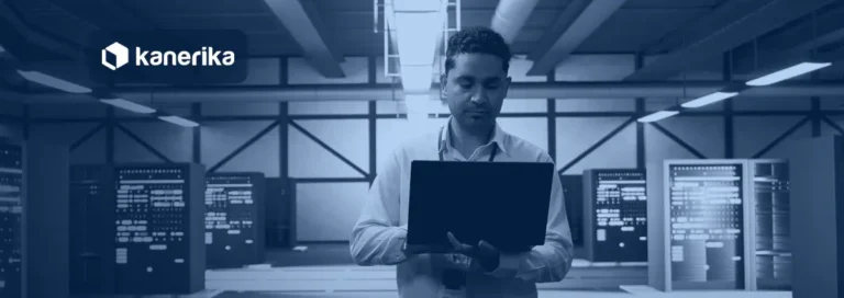 Engineer with a laptop in a data center planning SAP data migration tools and platform moves, Kanerika banner