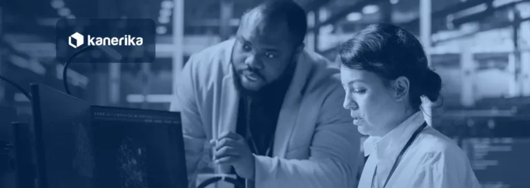 Data center manager and engineer reviewing an AI agent on a monitor, navy duotone banner for Kanerika's AI agent examples guide