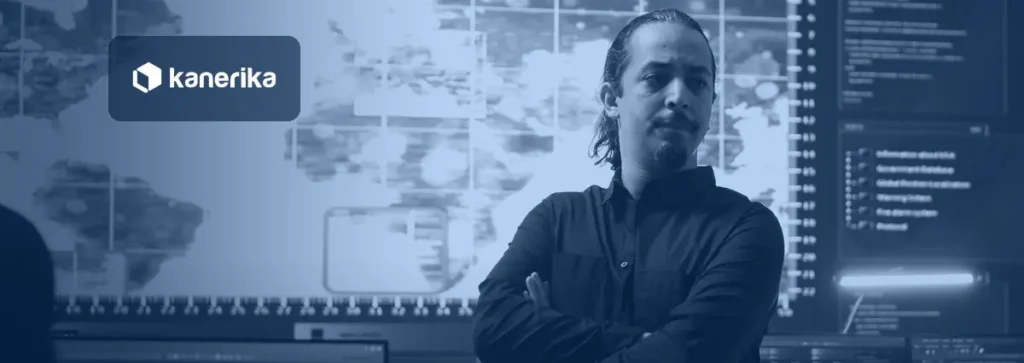 AI guardrails control room: a security lead stands in front of a monitoring wall of maps and system logs