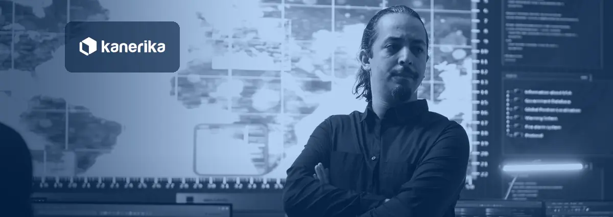 AI guardrails control room: a security lead stands in front of a monitoring wall of maps and system logs