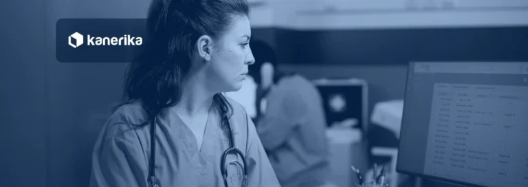 Nurse in blue scrubs reviewing an appointments list on a clinic computer monitor, Kanerika banner for automation in healthcare