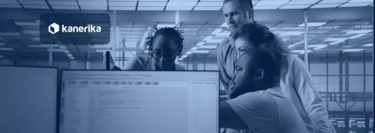 IT engineers planning a cloud migration together at monitors in a data center, navy-toned Kanerika banner for Azure migration tools