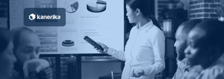 Manager presenting a business intelligence dashboard of charts to a seated team, banner for business intelligence vs data visualization
