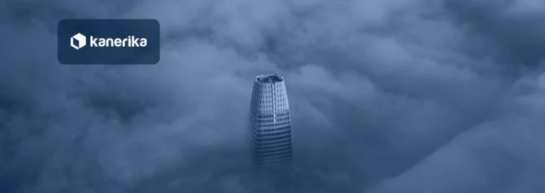 Skyscraper rising above a sea of clouds, navy-toned Kanerika banner for cloud transformation strategy