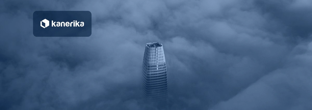 Skyscraper rising above a sea of clouds, navy-toned Kanerika banner for cloud transformation strategy