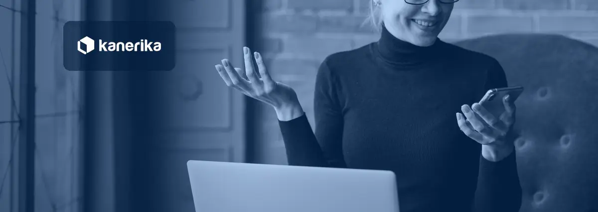 Kanerika banner for conversational AI vs generative AI: a smiling woman in a black turtleneck using an AI assistant on her phone with a laptop on her lap