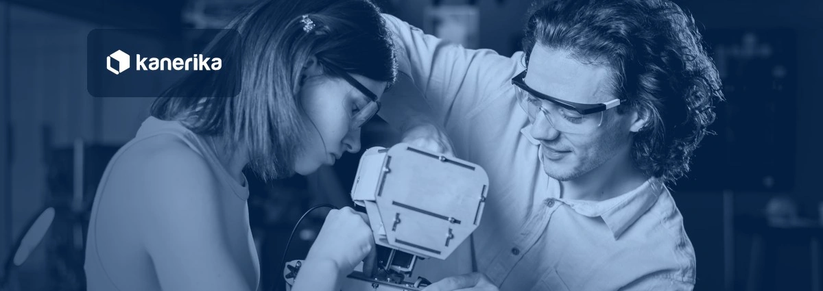 Two engineers building a custom robot together in a lab, navy-toned Kanerika banner for custom AI agents