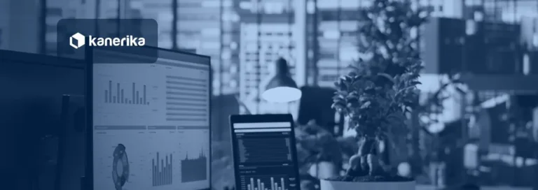 Kanerika blog banner for data accessibility, analytics dashboards on office screens in a bright workspace