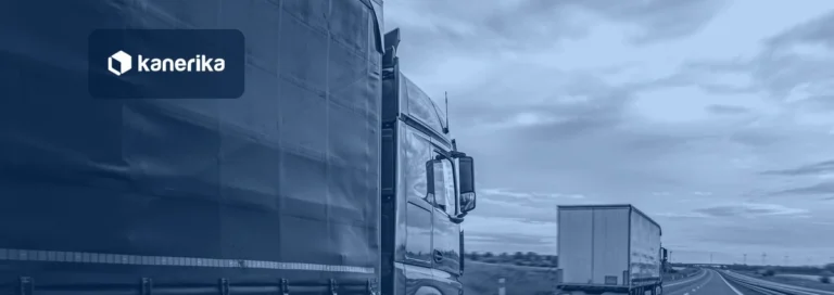 Freight truck driving on a highway at dusk, navy-toned Kanerika banner for data analytics in logistics