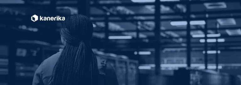 Software developer walking through a data center server room with rows of storage racks, the warehouse and fabric infrastructure behind enterprise data
