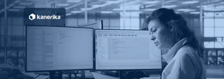 Data integrity testing: an analyst checks records against documentation beside two monitors of query results in a data operations room