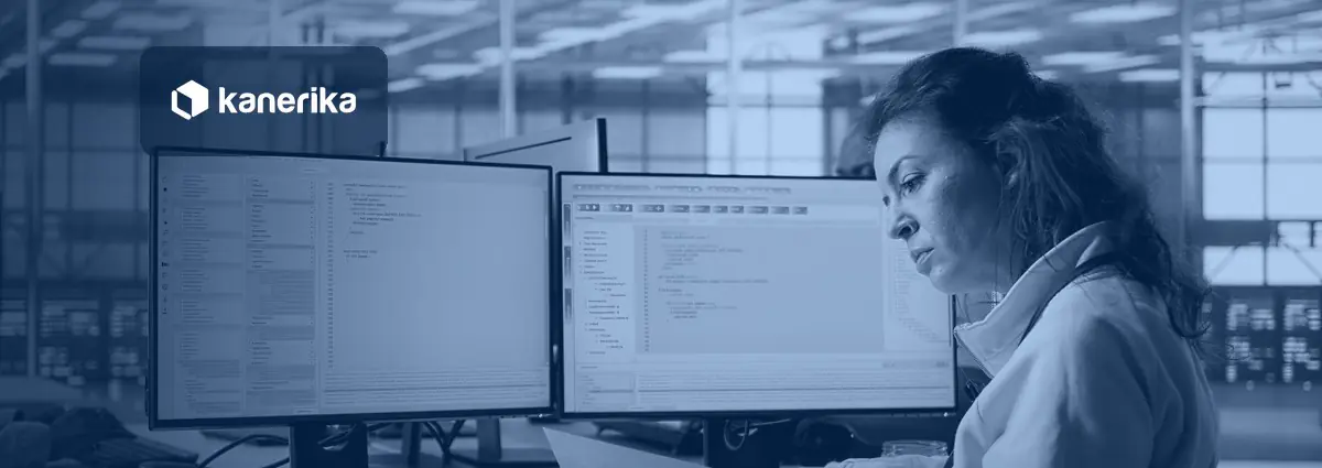 Data integrity testing: an analyst checks records against documentation beside two monitors of query results in a data operations room