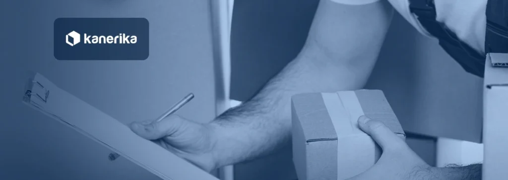 Courier's hand holding a clipboard checklist next to a taped cardboard box, representing a data migration checklist, shown in a navy blue tint with the Kanerika logo