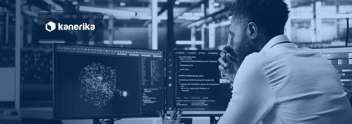 Developer at a dual-monitor workstation in a data center reviewing code and a cluster diagram, representing Databricks performance optimization