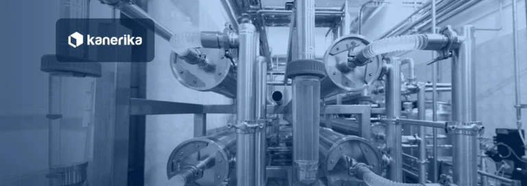 Stainless steel industrial pipes and valves, a visual metaphor for an ETL data pipeline, shown in a navy blue tint with the Kanerika logo