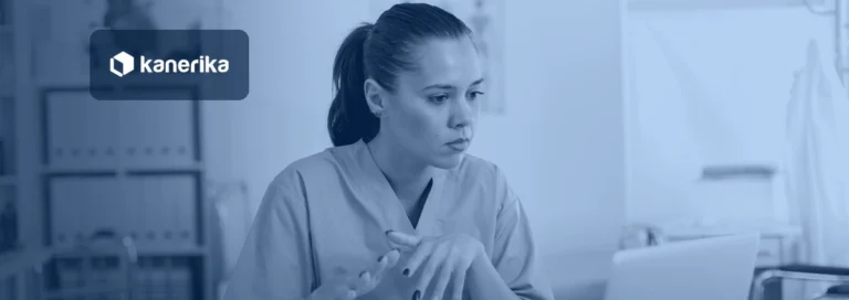 Nurse reviewing patient information on a laptop at a hospital desk, navy-toned Kanerika banner for AI agents in healthcare
