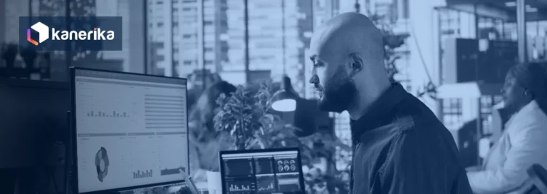 Analyst reviewing business reports and dashboards on a monitor during a Crystal Reports to DevExpress migration