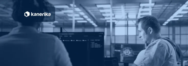 Engineers monitoring AI agent infrastructure on screens in a high-tech server room