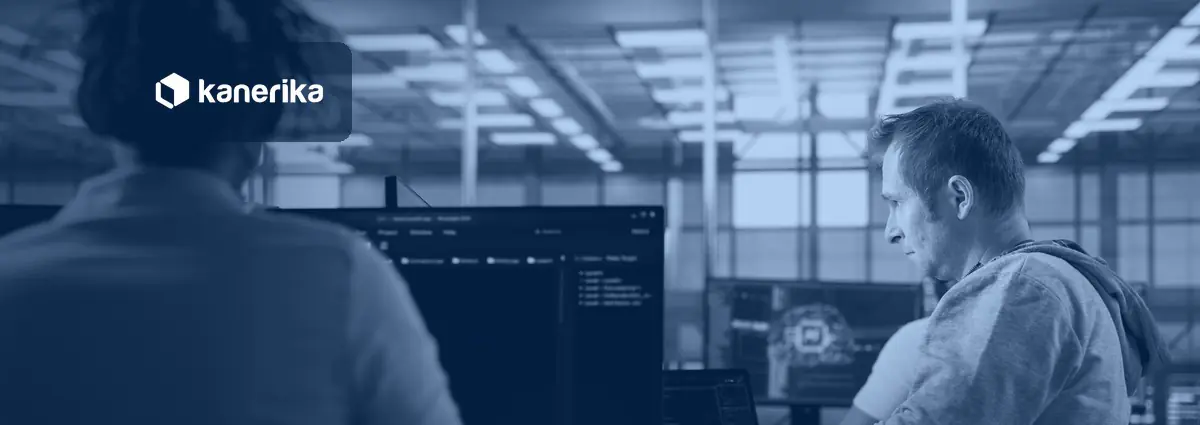 Engineers monitoring AI agent infrastructure on screens in a high-tech server room