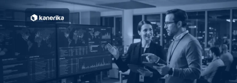 Data analysts in a control room reviewing connected data dashboards for a data fabric architecture