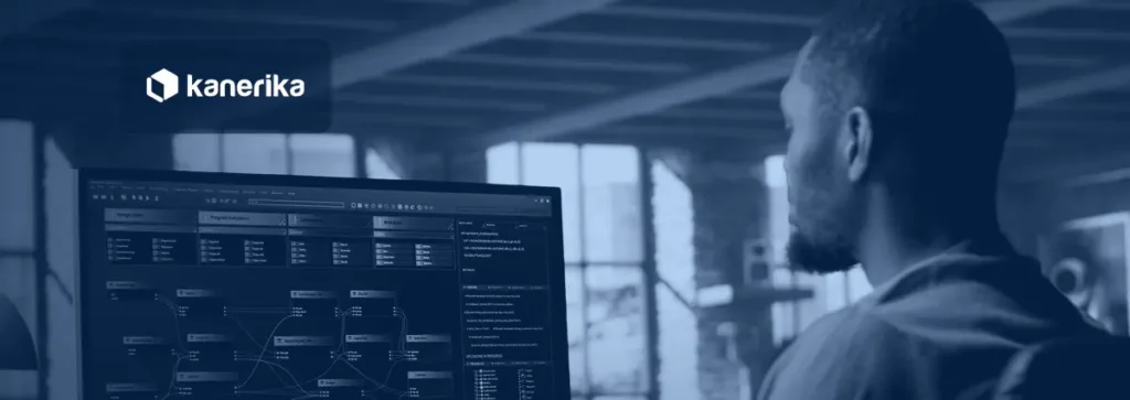 Data engineer building a visual data pipeline workflow on a monitor for a data pipeline vs ETL comparison