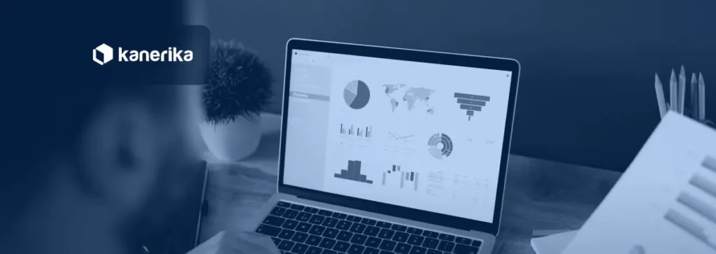 Kanerika banner for DAX calculated columns and tables in Microsoft Fabric, a laptop showing a Power BI style analytics dashboard