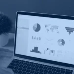 Kanerika banner for DAX calculated columns and tables in Microsoft Fabric, a laptop showing a Power BI style analytics dashboard