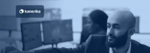 Enterprise manager reviewing dashboards on several monitors in a monitoring room, illustrating oversight of an enterprise LLM