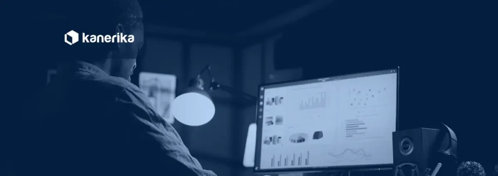 Analyst reviewing a monitoring dashboard on a screen, illustrating LLM observability and monitoring