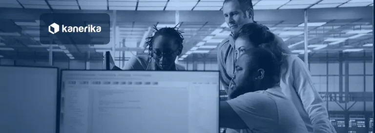 Engineering team reviewing data on a shared screen for Microsoft Fabric OneLake shortcuts architecture
