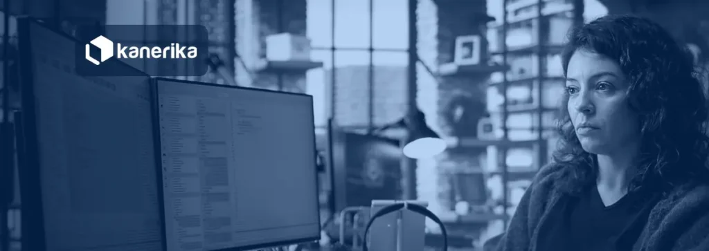 Developer writing TypeScript on dual monitors, illustrating Microsoft Rayfin app backend development on Microsoft Fabric