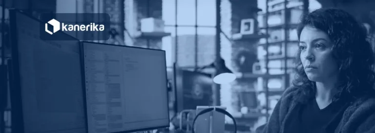 Developer writing TypeScript on dual monitors, illustrating Microsoft Rayfin app backend development on Microsoft Fabric