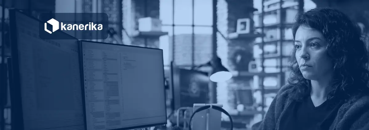 Developer writing TypeScript on dual monitors, illustrating Microsoft Rayfin app backend development on Microsoft Fabric