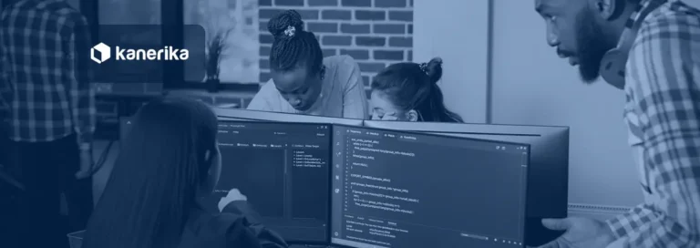Developers reviewing open source AI agents code on multiple screens in a team office