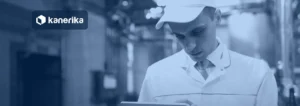 Technologist in a white coat using a tablet on a food factory floor, banner image for the Kanerika QAD Fabric mirroring guide