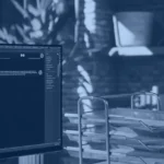 Employee typing a question into an AI chat assistant at a desk, illustrating a RAG application answering from company documents