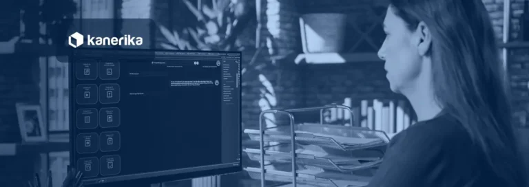 Employee typing a question into an AI chat assistant at a desk, illustrating a RAG application answering from company documents