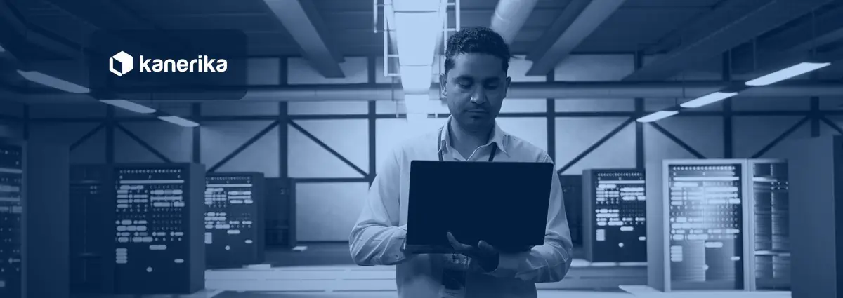 Engineer with a laptop in a server hall, illustrating continuous file loading with Snowflake Snowpipe