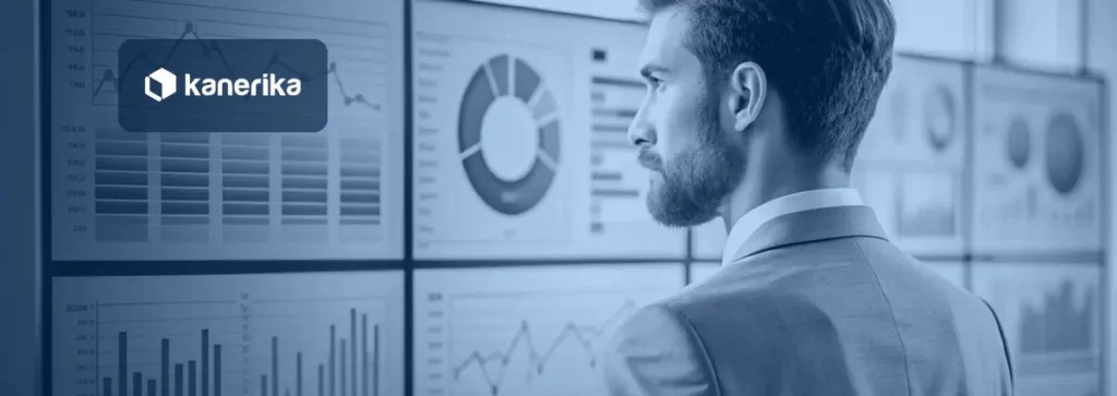 Kanerika banner for machine learning in predictive analytics, an analyst in a grey suit studying charts and dashboards on a wall of screens
