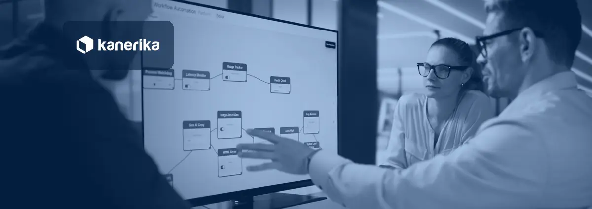 Kanerika banner for Power Apps vs Power Automate: a team of colleagues around a large monitor showing a workflow automation diagram while one points at a step