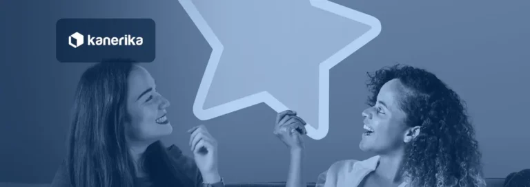Two smiling women on a sofa looking up at a large gold rating star, in a navy blue tint with the Kanerika logo, for a post comparing the best sentiment analysis tools